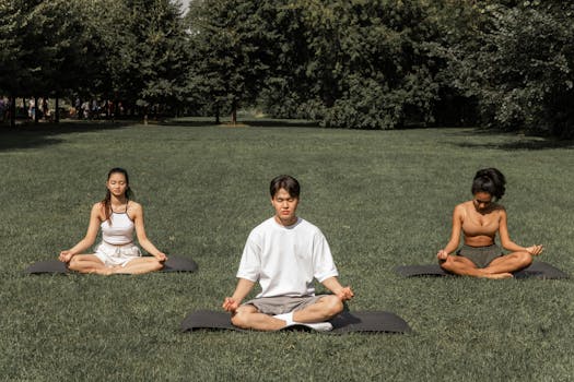 group doing yoga outdoors
